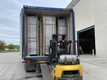 North America import and wholesale company receiving container shipment of steel doors