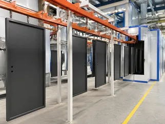 EUWOO in-house powder coating line for steel door surface finishing and color consistency