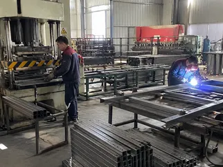 EUWOO steel door frame welding and pressing operations on the factory floor