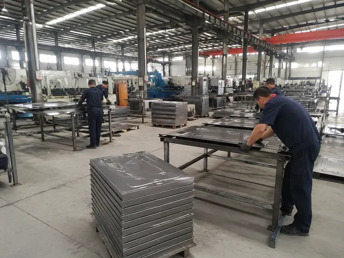 EUWOO factory floor showing steel door OEM production line