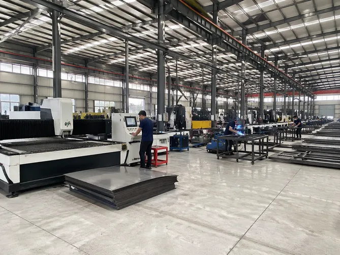 EUWOO security door factory production floor with CNC cutting and welding stations